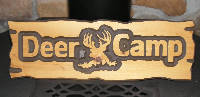 wooden deer camp sign